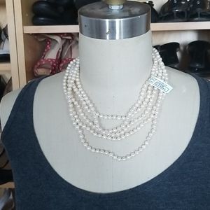 White 100" cultured pearl